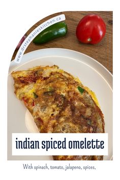 a plate with an omelette on it next to a pepper, tomato, and jalapeno