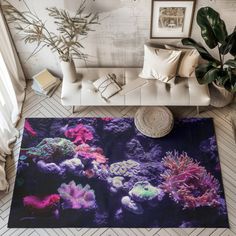 an aerial view of a living room with corals and plants