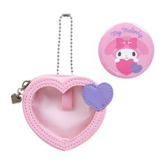 a pink heart shaped purse with a keychain attached to it and a badge that says, my melody