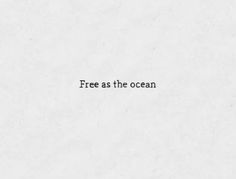 the words free as the ocean written in black ink