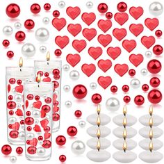 red and white heart shaped candles surrounded by other valentine's day decorating items