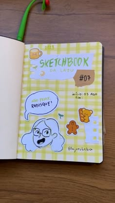 an open notebook with stickers on it