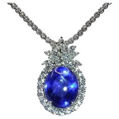 This timeless elegant Blue Star Sapphire Diamond Pendant Necklace will never go out of style! Transparent with minimal impurities, the stunning centerpiece 26.88-carat oval cabochon cut star sapphire radiates a saturated royal blue color. With the phenomenon known as Asterism, this star sapphire shimmers in 6 rays with silky luster when it is hit by light. Certified by Gublin and GRS, untreated by heat, this natural Blue Star Sapphire from Ceylon (Sri Lanka) origin is a rare prized find. The mai Diy Jewelry Gift Box, Sapphire Diamond Pendant, Blue Sapphire Necklace, Blue Star Sapphire, Star Sapphire, Sapphire Pendant, Expensive Jewelry, Diamond Chain, Sapphire Necklace