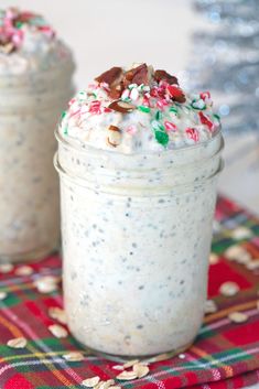 two mason jars filled with white chocolate and sprinkles