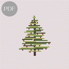 a cross stitch christmas tree on a white background