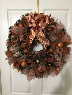 a wreath is hanging on the front door