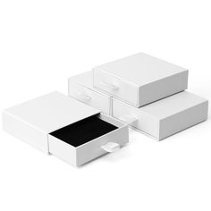 three white boxes are stacked on top of each other with one open and the other closed