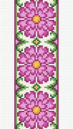 a cross stitch bookmark with pink flowers