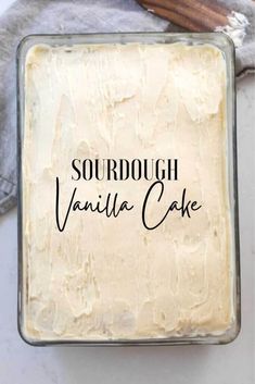 a square cake in a pan with the words sourdough vanilla cake on it