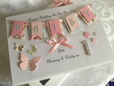 a birthday card with pink and white decorations