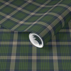 a green and yellow plaid wallpaper with a white circle on the bottom right corner