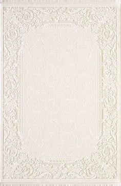 a white rug with an intricate design on it