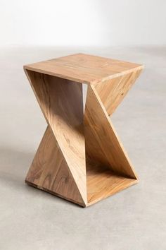 a wooden table with an unusual design on the top and bottom, made out of wood