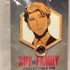 an anime character pin with the name spy x family on it's back side