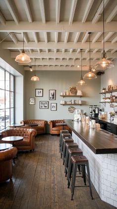 the interior of a restaurant with leather seating