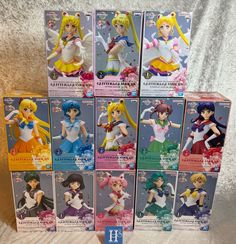 six sailor moon figurines are on display in the box, and one is for sale