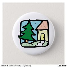 a white button with a house in the garden by shopahily on it's side