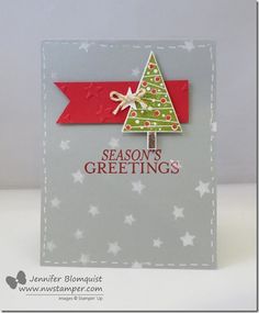 a card with a christmas tree on it and the words season's greetings