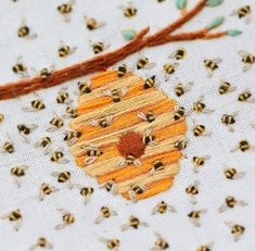 a bunch of bees that are on some fabric