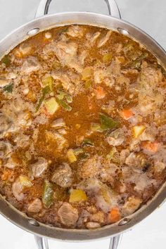 a large pot filled with soup on top of a stove