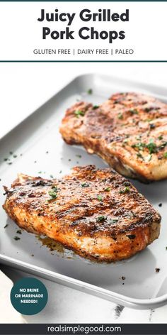 juicy grilled pork chops on a white plate