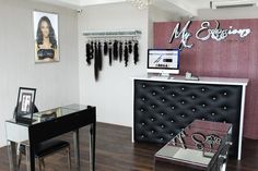 a hair salon with black and white furniture