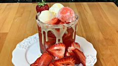 a dessert with strawberries and ice cream on a plate