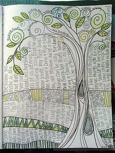 an open book with a tree drawn on it