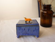 a blue box sitting on top of a white table