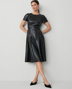 Elevate your wardrobe with the Ann Taylor Faux Leather Pleated Midi Dress, a perfect blend of sophistication and modern flair. This dress is designed to impress with its luxurious faux leather and elegantly pleated skirt that adds a touch of feminine edge.

- Size: Regular - 4
- Color: Black
- Gender: Female
- Material: Shell - 100% Polyester with Polyurethane Coating; Lining - 100% Polyester
- Features: Crew neck, short sleeves with back raglan seams, self-tie buckle belt, hidden back zipper wi A Line Black Dress, Leather Midi Dress, Pleated Midi Dress, Sleeve Dresses, Buckle Belt, Petite Fashion, Petite Dresses, Black Midi Dress, Polished Look