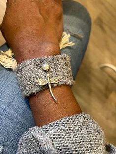 a close up of a person wearing a bracelet