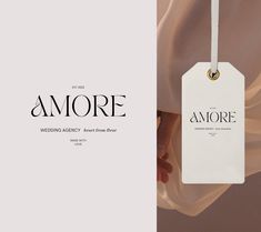 a white tag hanging from the side of a woman's dress with an ad for amore on it