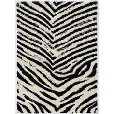 a zebra print rug with black and white stripes