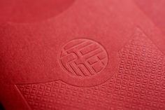 closeup of the logo on a red book