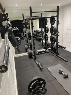 A UK garage gym filled with Mirafit gym equipment Home Gym Garage Uk, 1 Car Garage Gym Ideas, Tandem Garage Gym, Uk Garage Gym, Garage Gym Corner, Garage Gym Uk, Single Garage Gym, Single Car Garage Gym, Small Basement Gym Ideas