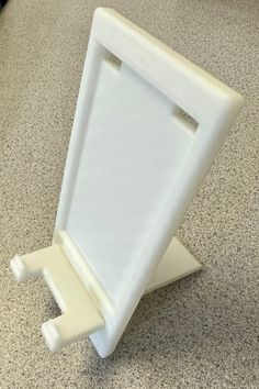 This phone stand I created slides apart and clips to itself to store in suit case or travel on real easy. "See picture"it has teo distinc desins  one side flat and edgy the other rounded and has feet to to hold phone in place. notched for charging cable. Supports Iphone 12 pro max just fine and also has a indent for the popsocket to slide into. I designed it for me to travel but been told by others they would love one. So here I am . It is 3d Printed plastic. Standard is the black color.  White in pictures manly to show as much as possible in pictures. This is a rough and fast print, the one you will receive will be smoother and cleaner edges. Thank you for looking. Due to item created for purchase , I do not offer returns and refunds. However please contact me , may make exceptions. Phone Stand, Charging Cable, 3d Print, 3d Printed, Ipad Case, Iphone 12, Black Color, Slides, Color White