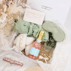 an open gift box containing personal care items and a thank you note on the top