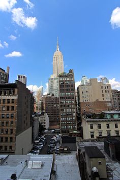 a view of the empire building in new york city from an upper floor apartment window