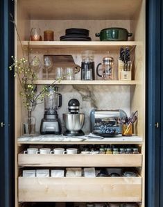 an open cabinet with many items on it