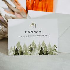 there is a card that says hannah will you be my bridesmaid on it