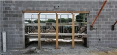 a bench sitting in front of a building under construction