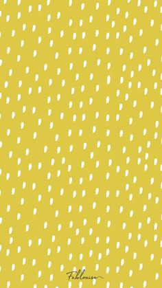 a yellow background with white polka dots