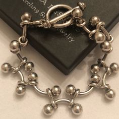 Vintage Silpada Sterling Silver Bracelet With Interlocking Curved Bars And Balls B0746. Known As The Iconic “Baby Dna” Bracelet. Fits Up To A 7” Wrist And Has A Toggle Clasp. Solid, Stunning Vintage Silpada. Gorgeous And Easy To Wear. Dna Bracelet, Curved Bars, Silpada Jewelry, Sterling Silver Bracelet, Toggle Clasp, Womens Jewelry Bracelets, Sterling Silver Bracelets, Silver Bracelet, Women Jewelry