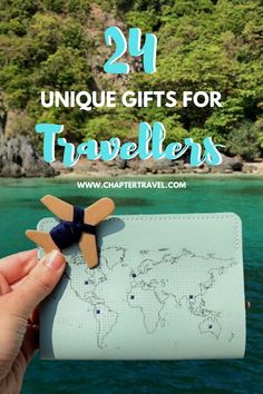 a person holding up a travel tag with the words, unique gifts for travelers