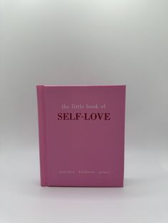 the little book of self - love is on display in front of a white background