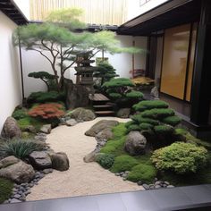 a japanese garden with rocks and trees