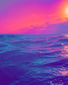 the sun is setting over the ocean with purple and pink hues on the water