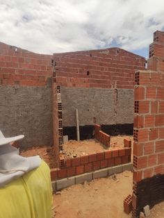 a brick house being built in the middle of nowhere