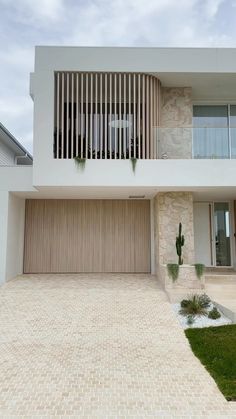 a white house with wooden shutters on the front