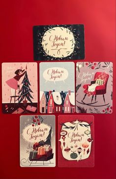 four coasters with christmas designs on them sitting next to each other in front of a red background